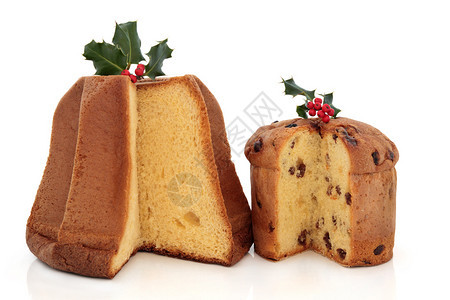 Panettone和潘多罗的圣诞节蛋糕白上装饰着图片