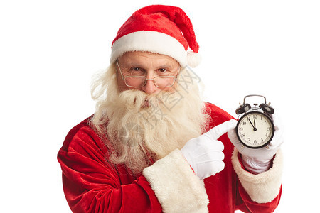 圣诞老人用闹钟指着闹钟图片