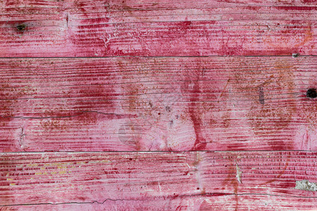 背景由漆成粉红色的木板组成图片