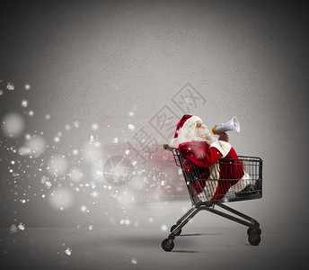 快速圣诞老人在购物车里通过图片