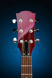 红木材质电吉他头蓝色背景背景