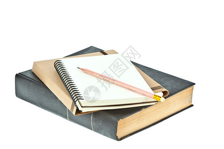棕色书上浅奶油色纸笔记本上的铅笔图片