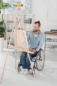 坐在帆布上轮椅绘画上的图片