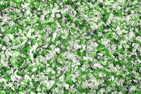 白色和绿色破碎的玻璃回收背图片