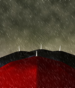 大雨中黑人中间的红伞图片