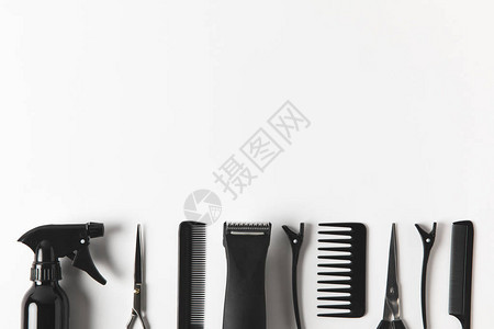 排成一排的理发剪和美发工具的顶部视图图片
