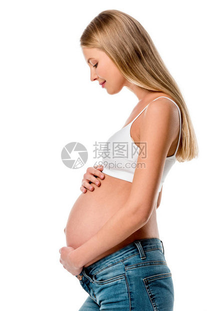 有吸引力的孕妇触摸其腹部的侧面图片