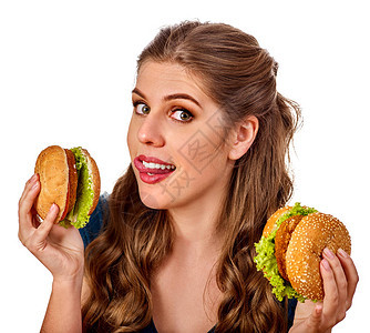 女人吃汉堡学生在桌子上吃快餐教烹饪和分享食谱女孩一个人吃垃圾没有尴尬图片
