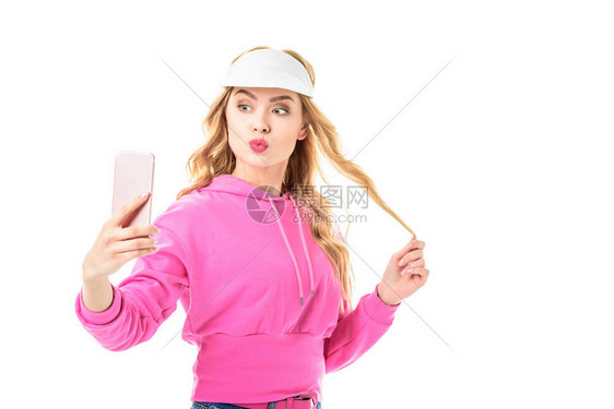 穿着粉红色装扮的迷人年轻女子拍着白图片