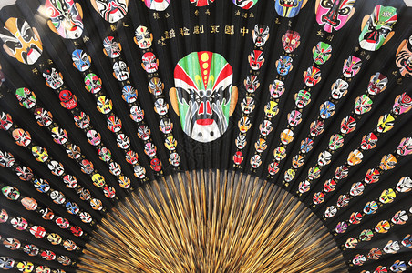 京剧戴面具的扇子背景图片
