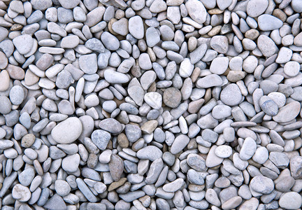 鹅卵石背景高清背景图片石头上的金属珠子高清背景图片地上的石子高清
