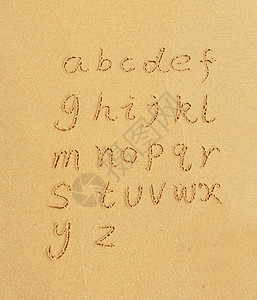字母手写在沙图片