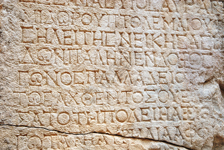 刻在石头上的古希腊文字背景图片