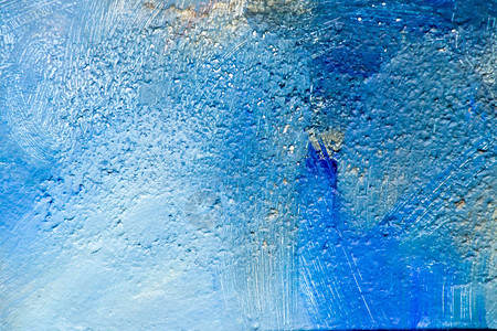 混凝土块背景的蓝彩画摘图片