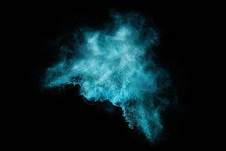 蓝色尘埃粒子爆炸类似于雪或黑色的烟火效果在黑色上隔离的颜图片