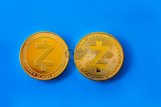 蓝色背景上是数字加密货币的孤立金币图片
