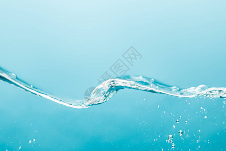 蓝色背景上带有气泡的透明纯净水波图片