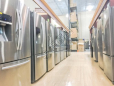 带制冰机的全新法式对开门冰箱的广泛选择美国德克萨斯州欧文市的一排不锈钢冰箱模糊零图片