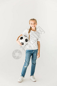 可爱的快乐的孩子拿着足球图片