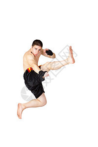 年轻的跆拳道运动员被白色隔离图片