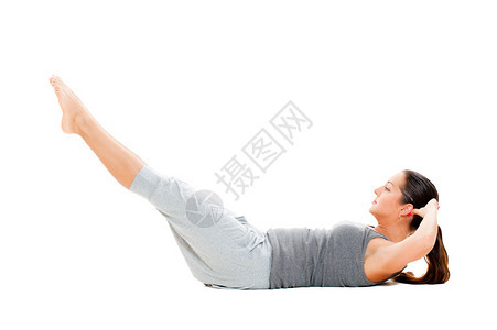 年轻女为腹部肌肉做锻炼白图片