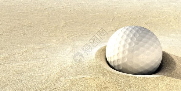 一个深塞在沙坑里的球图片