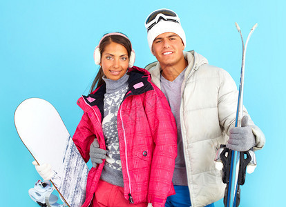 穿着雪板和滑雪衣的冬装女美和图片