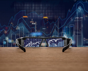证券交易所市场交易图表集中在木制眼镜片上图片