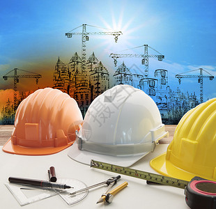 建筑和起重机施工背景的工程师工作台用于建筑业务和土木工程图片素材
