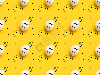 黄色笑脸彩绘鸡蛋的顶部视图图片