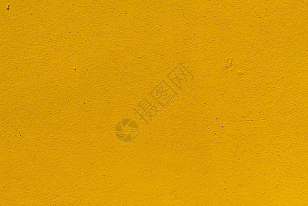 黄色风化粗糙墙壁纹理的特写视图背景图片