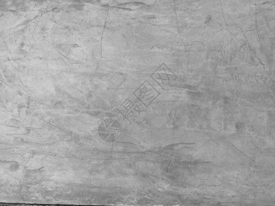 水泥墙上的裂缝有灰色和平滑的抽象表面纹理混图片