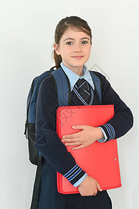 身着校服的10岁女学生携带一个书包图片