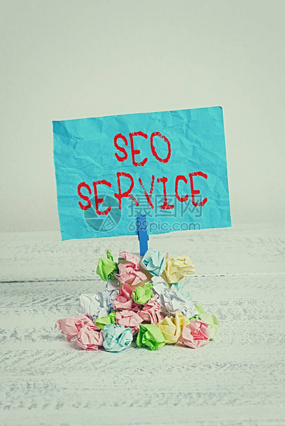概念手写显示Seo服务提高网站知名度的概念意义技术和程序提醒堆彩色皱纸图片
