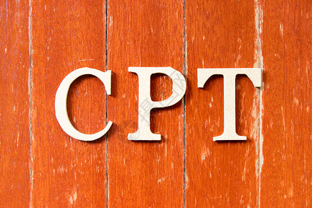 国际贸易使用旧红色木板本底的CPT简化付车费字母背景