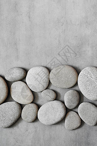 灰色的spa石头和灰色的背景水疗概念图片