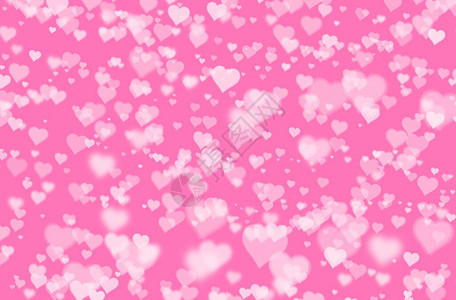 粉色面粉背景上的模糊心脏形状布基情人背景图片