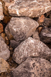 大灰色棕褐色不平的石头采图片