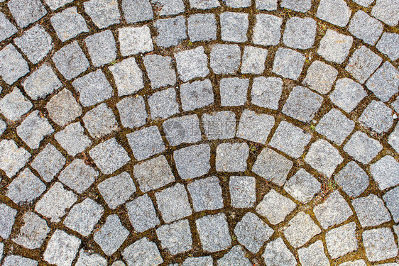 花岗岩石的铺面古老的cobblestone路面结构石块之间的抽象背图片