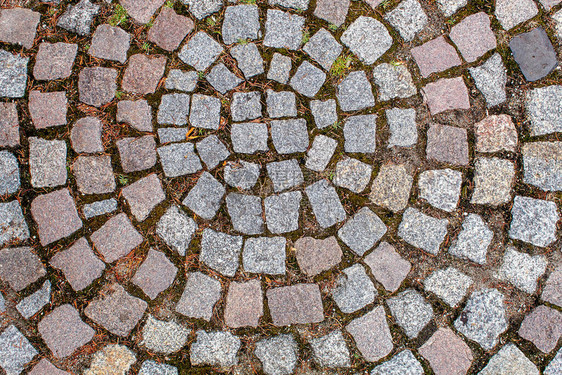 花岗岩石的铺面古老的cobblestone路面铺纹理抽象背图片