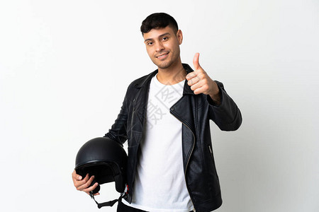 戴摩托头盔的男子在白色背景上被孤立用拇指举起大拇指因图片