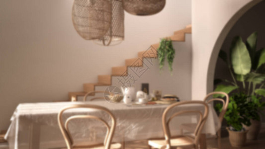 模糊背景室内设计带桌椅的复古餐厅自助早餐经典吊灯带盆栽植物的拱门图片