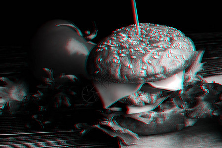 含有肉奶酪生菜番茄和洋葱近端的自制汉堡包带有3D大故障虚拟现图片
