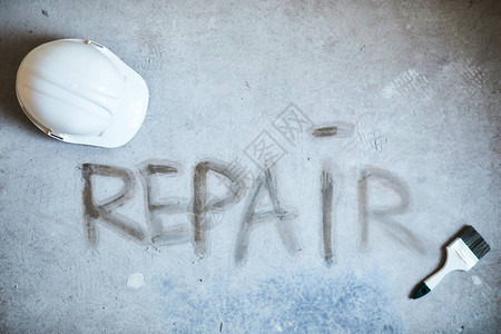 REPAIR在混凝土地板上用建筑工具建造房屋复制空间的文图片