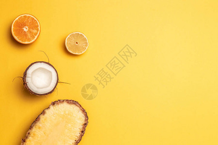 热带菠萝橙子柠檬和椰子图片