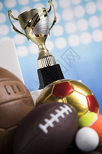 奖杯和运动球背景图片