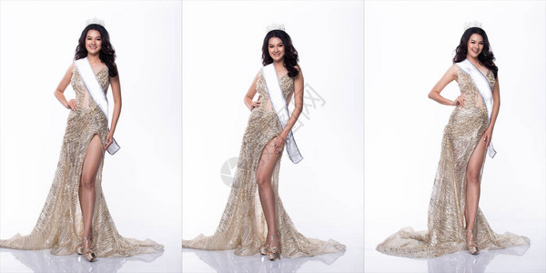 亚洲小姐选美大赛的肖像在亮片晚礼服长裙与闪发光的钻石皇冠图片