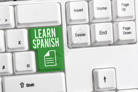 概念手写显示学习西班牙语概念意义翻译语言在西班牙词汇方言语音白色pc键盘与白色背景图片