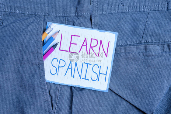 手写文本西班牙语西班牙概念照片翻译语言词汇方言语音书写设备和男士工作裤口袋内图片
