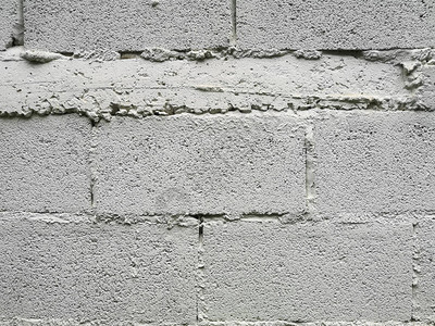 灰砖砌块墙展示图案堆砌块粗糙表面纹理材料背景用水泥浆白色图片